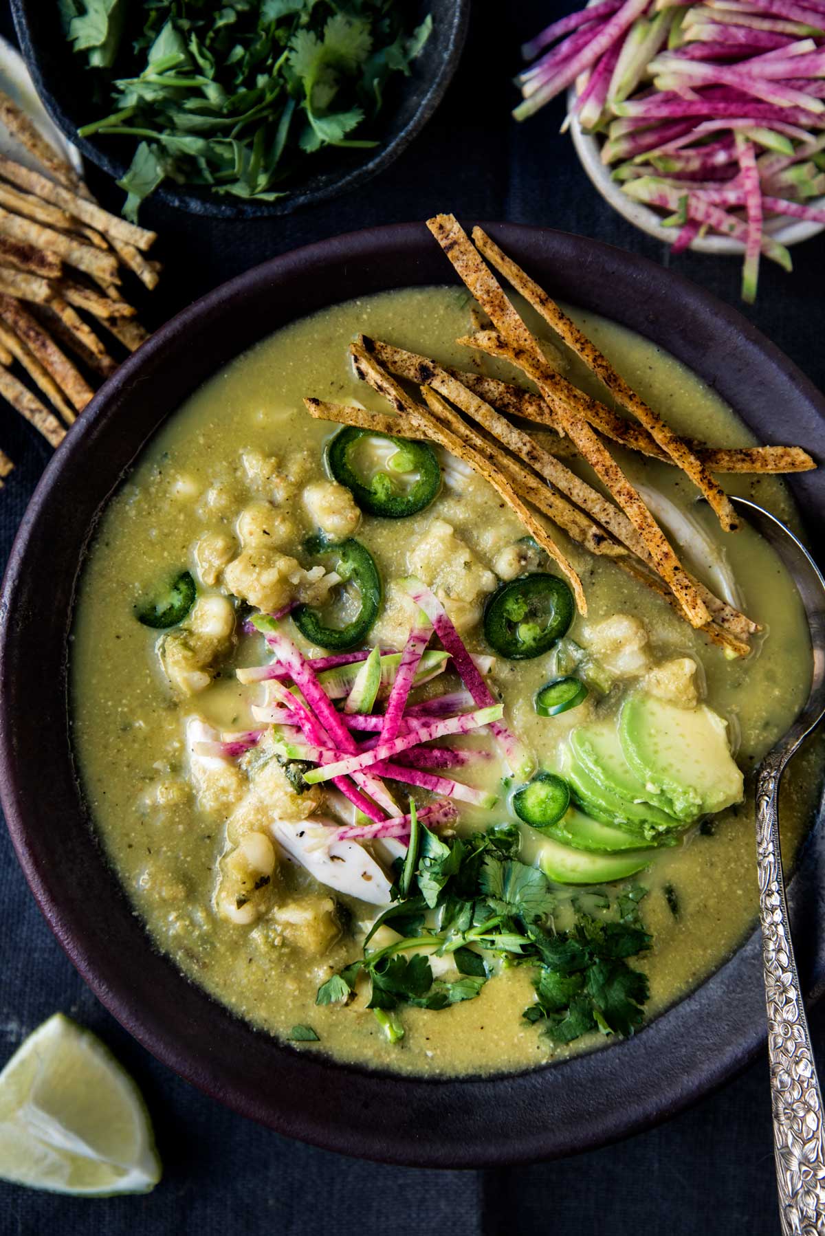 chicken pozole verde with toppings.